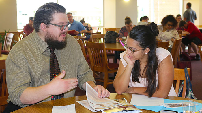 Academic advisor, John Hall, helping a student during the Adult Student Welcome. 